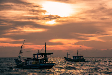 Beautiful sunset with fishing boat