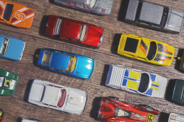 vintage toy cars on a wooden background