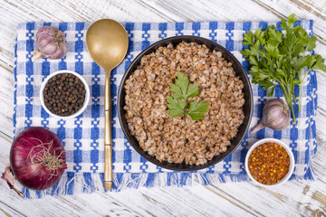 Food background. The boiled buckwheat porridge closeup.