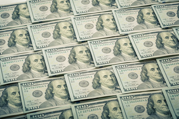 Lot of one hundred dollar bills close-up background