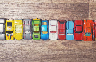 vintage toy cars on a wooden background