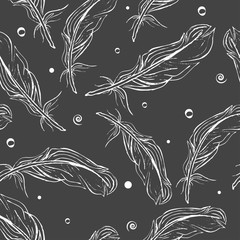 Seamless pattern white hand-drawn feathers on a dark grey background. Vector