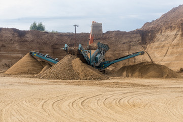 Excavator loader working at sand mine