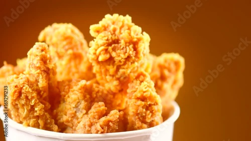 Download "Fried chicken wings and legs. Bucket full of crispy kentucky fried chicken. Rotation 360 ...