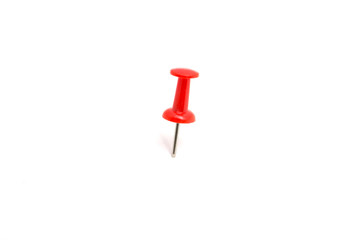 Red color push pin and on isolated white background
