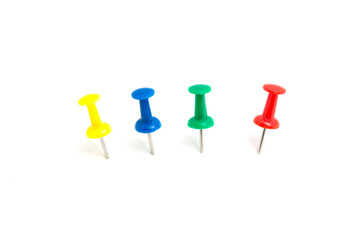 Four color push pin and on isolated white background