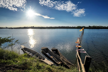 three boats park in lakeside in sunrise