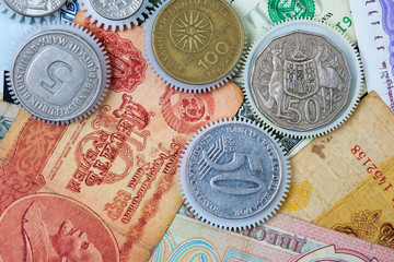coin gear on the background of banknotes