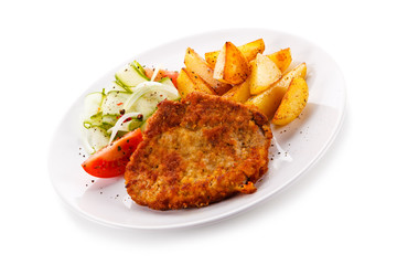 Fried pork chop, chips and vegetable salad