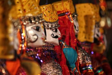 Close up of Colorful Indian Puppets with traditional head gear