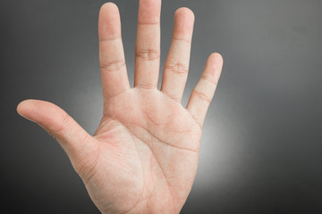 Man hand showing the five fingers isolated