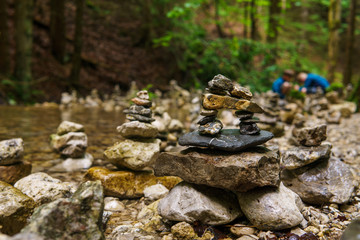 stone statues on a mountain stream