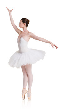 Ballerina in ballet position on white isolated background