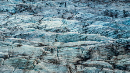 View of deep blue huge ice floes in the Fjallsárlón Glacier. Iceland in summer, Europe.