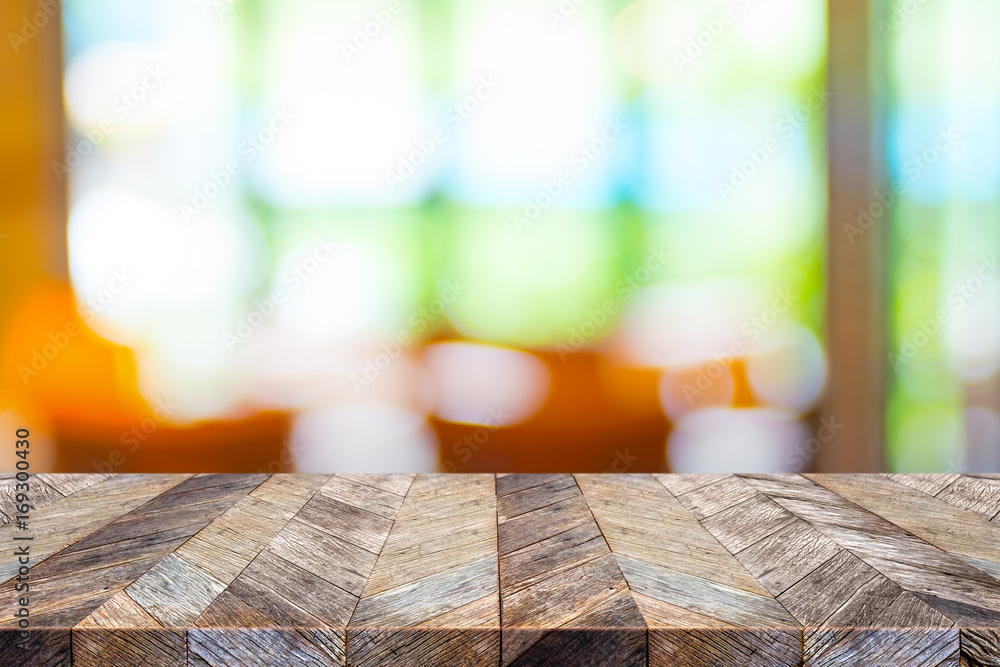 Aufkleber empty tropical wood table and blurred cafe near garden bokeh light background. product display templ