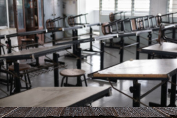 table and chair in art classroom in college. room in school. education, learning, studying concept with wood table for display your product