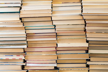 A stack of books with colorful covers. The library or bookstore. Books or textbooks. Education and reading.