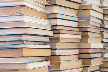 A stack of books with colorful covers. The library or bookstore. Books or textbooks. Education and reading.