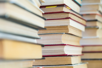 A stack of books with colorful covers. The library or bookstore. Books or textbooks. Education and reading.