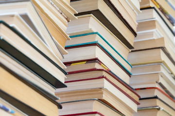 A stack of books with colorful covers. The library or bookstore. Books or textbooks. Education and reading.