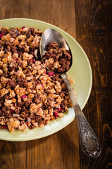 Granola in a bowl wooden background