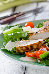 Grilled chicken salad with tamatoes and parmesan cheese