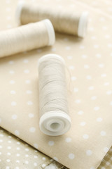 Fabrics and threads on wood