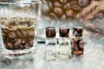 glass of coffee for taster to smell and taste aromatic and flavor wheel. aroma perception in brewed coffee double exposure with roasted bean. cupping examination.