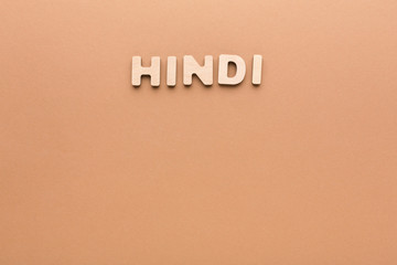 Word Hindi on beige background