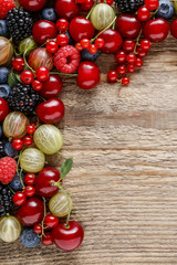 Delicious fruits on wooden background