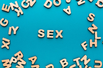 Word Sex in wooden letters frame