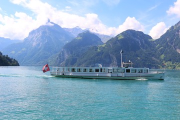 Swiss ferry in the green water of the Lucerne lake