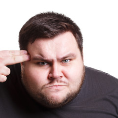 Obraz premium Angry man with fingers on temple, close up, isolated on white