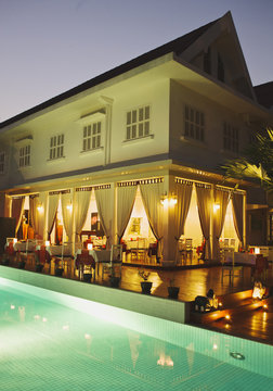 The poolside Elephant Blanc Restaurant at Maison Souvannaphoum.  Luang Prabang, Laos..