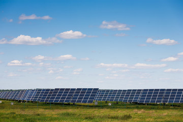 Solar panels against blue sky background