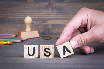 USA from wooden letters on wooden background.