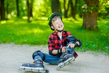 Boy crying falling on roller skates