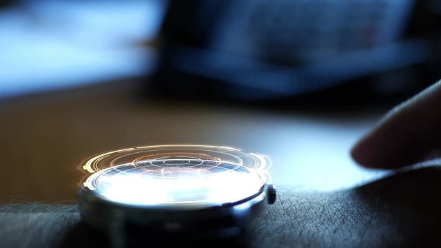 Futuristic digital watch with HUD buffering a signal - internet concept