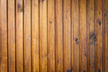 Wall of wooden straight varnished polished boards