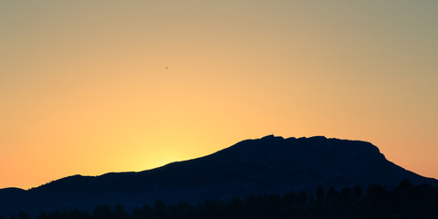 Fototapeta na wymiar sunrise on the Sainte-Victoire mountain, near Aix-en-Provence, which inspired the painter Paul Cézanne