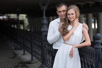 Naklejka premium A love couple, husband and wife, models stroll on a summer day. Relations, love, family values, wedding.