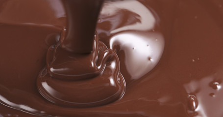 pouring melted premium dark chocolate