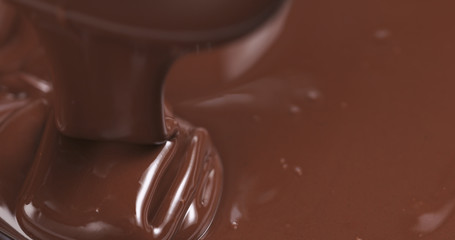 pouring melted premium dark chocolate