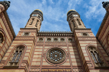 Budapest synagogue (Dohany Synagogue) main entrance taken from outside. The two iconic towers of the synagogue can be seen in the foreground. The Great Synagogue is the second biggest in the World - obrazy, fototapety, plakaty