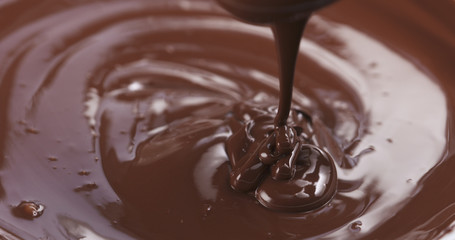 pouring melted premium dark chocolate