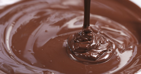 pouring melted premium dark chocolate