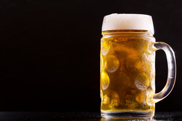 mug of beer on a dark background