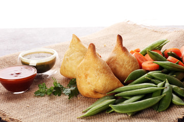 Indian special traditional street food punjabi samosa or Coxinha, Croquete and other Fried...