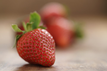 organic strawberries on wood table closeup