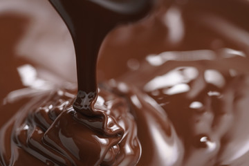 pouring melted premium dark chocolate